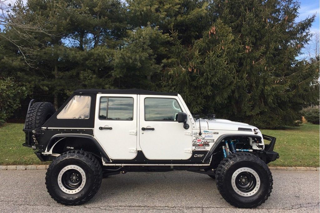 low miles 2013 Jeep Wrangler Freedom Edition monster