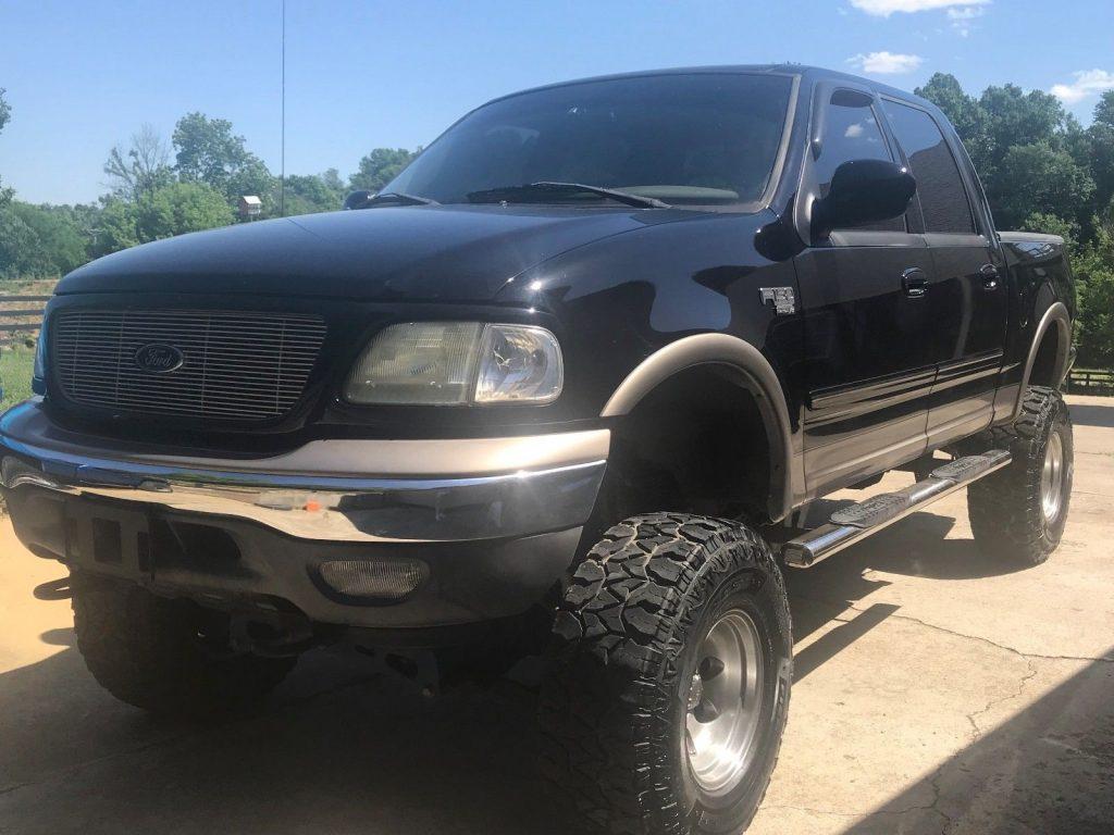 lifted 2003 Ford F 150 Lariat monster truck